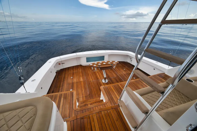 Makara Yacht Photos Pics Luxurious 2018 Viking 72 Sky Bridge yacht with teak deck and ocean view.