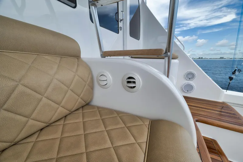 Makara Yacht Photos Pics Luxurious seating on 2018 Viking 72 Sky Bridge yacht with ocean view.