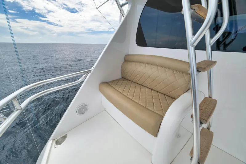 Makara Yacht Photos Pics Luxurious seating area on 2018 Viking 72 Sky Bridge yacht with ocean view.
