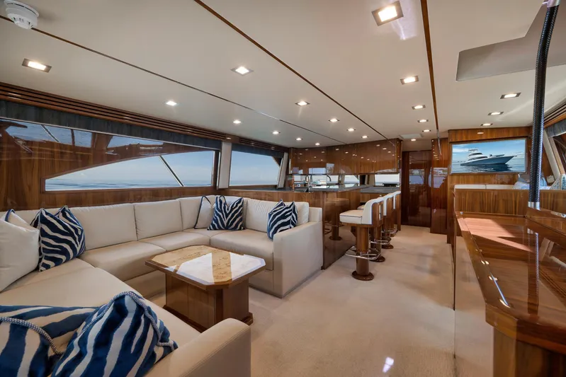 Makara Yacht Photos Pics Luxurious interior of 2018 Viking 72 Sky Bridge yacht with elegant seating and modern design.