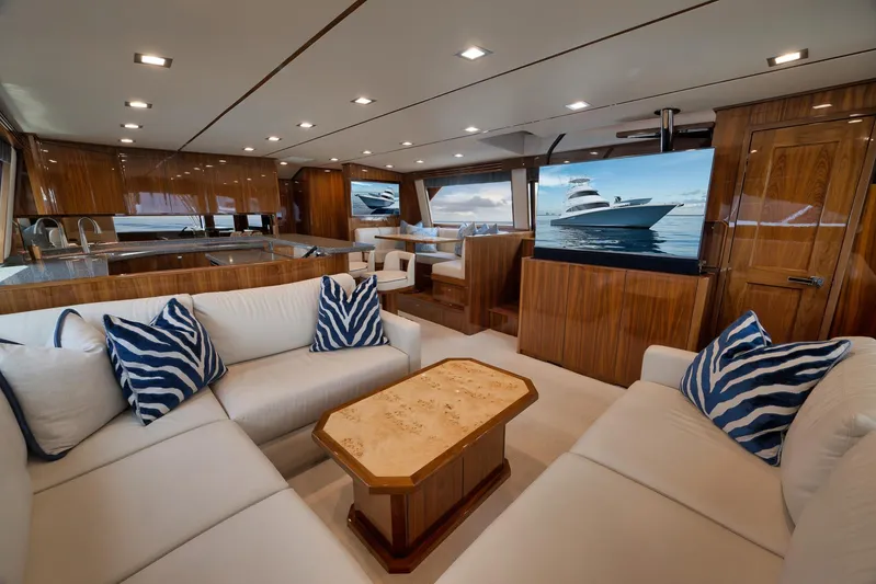 Makara Yacht Photos Pics Luxurious interior of 2018 Viking 72 Sky Bridge yacht with elegant seating and modern amenities.