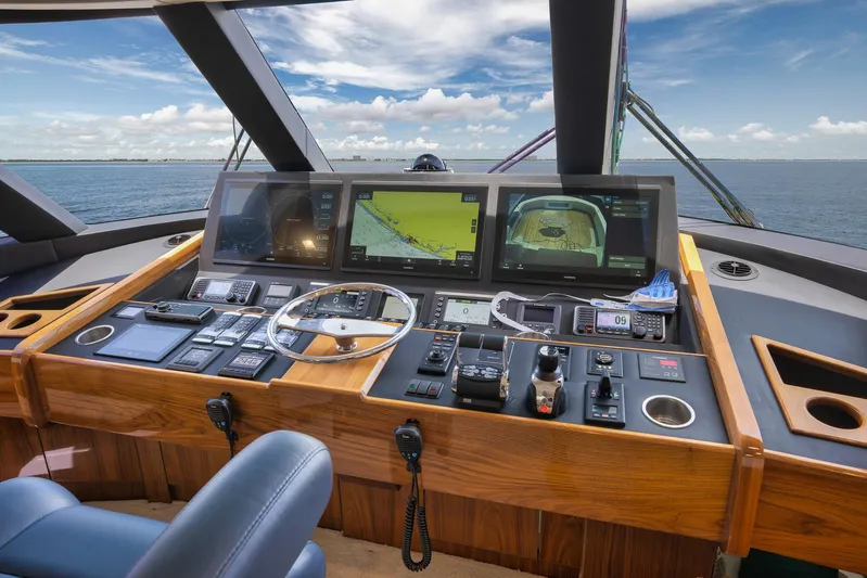 Makara Yacht Photos Pics 2018 Viking 72 Sky Bridge helm with advanced navigation systems and ocean view.