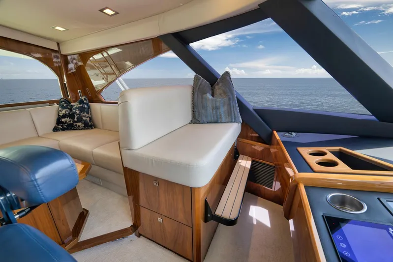 Makara Yacht Photos Pics Luxurious interior of 2018 Viking 72 Sky Bridge yacht with ocean view.