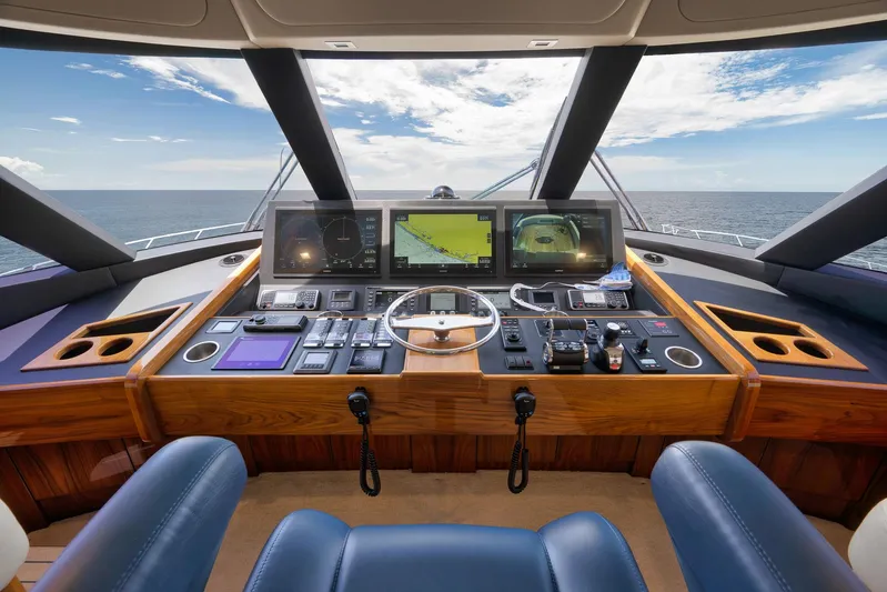 Makara Yacht Photos Pics Cockpit of 2018 Viking 72 Sky Bridge yacht with advanced navigation systems and ocean view.