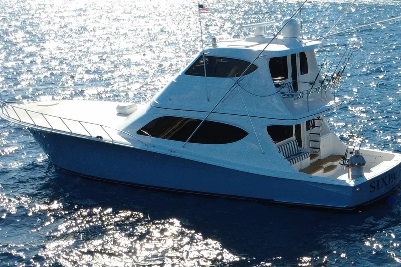 Sixpack Yacht Photos Pics 2013 Hatteras GT63 yacht on sparkling blue ocean waters.