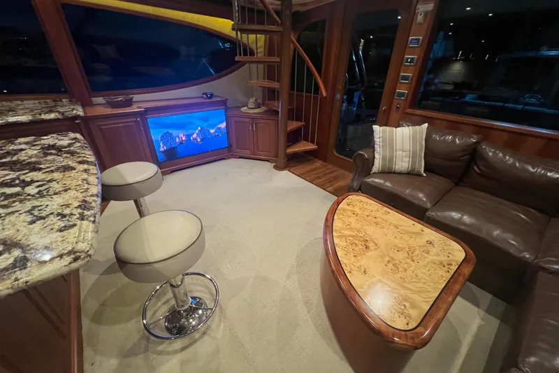Sixpack Yacht Photos Pics Luxurious interior of 2013 Hatteras GT63 yacht with elegant seating and modern decor.