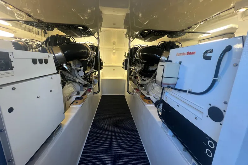 Sixpack Yacht Photos Pics Engine room of 2013 Hatteras GT63 yacht with Cummins Onan generator.