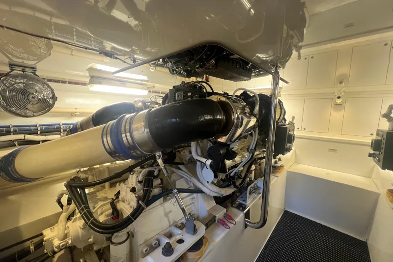 Sixpack Yacht Photos Pics Engine room of a 2013 Hatteras GT63 yacht, showcasing machinery and components.