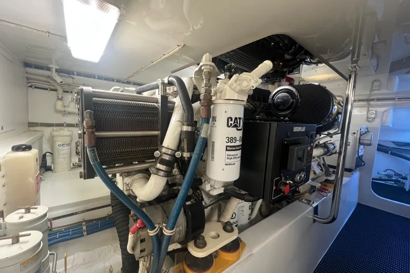 Sixpack Yacht Photos Pics Engine room of 2013 Hatteras GT63 yacht with Caterpillar marine engine components.