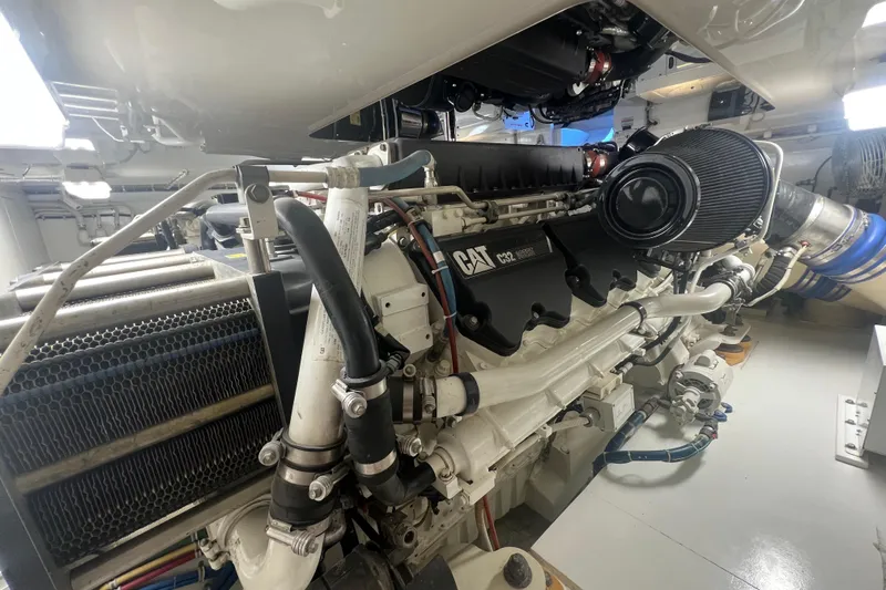 Sixpack Yacht Photos Pics Engine room of 2013 Hatteras GT63 yacht featuring CAT C32 engine components.