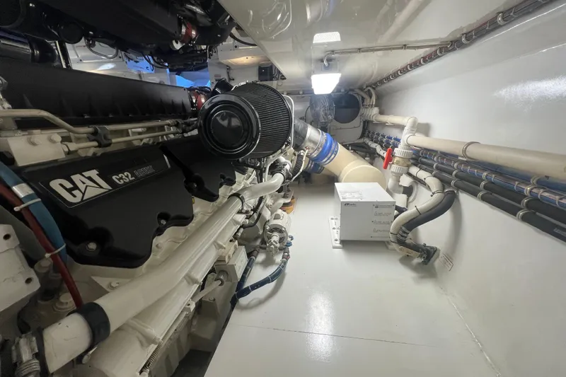 Sixpack Yacht Photos Pics Engine room of 2013 Hatteras GT63 yacht with CAT C32 engine.
