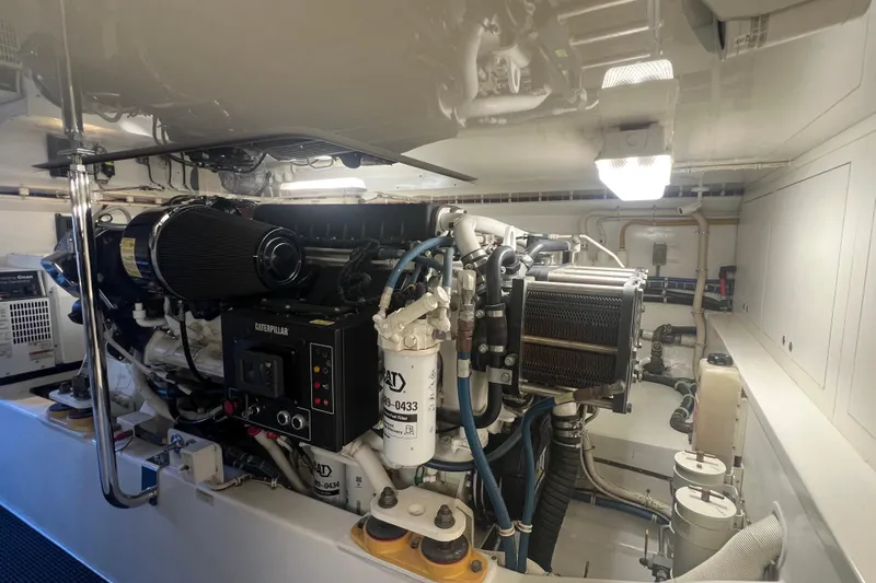 Sixpack Yacht Photos Pics Engine room of a 2013 Hatteras GT63 yacht, featuring Caterpillar machinery.