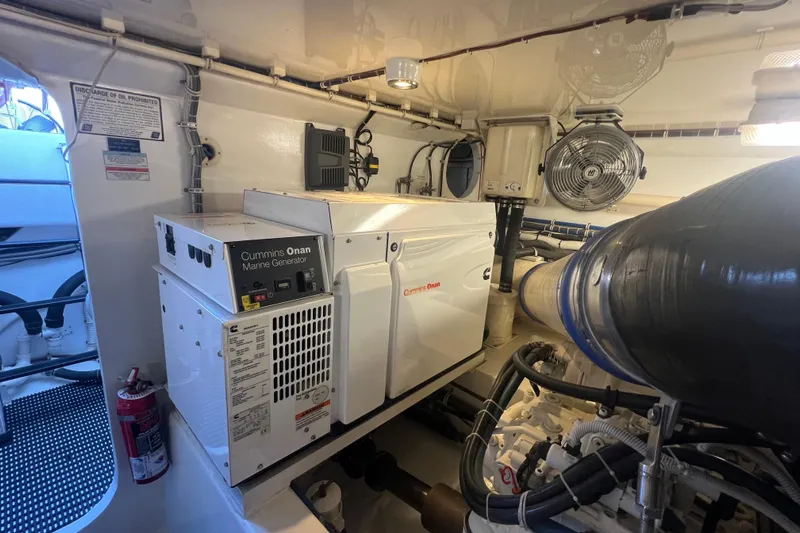 Sixpack Yacht Photos Pics Engine room of 2013 Hatteras GT63 with Cummins Onan marine generator.