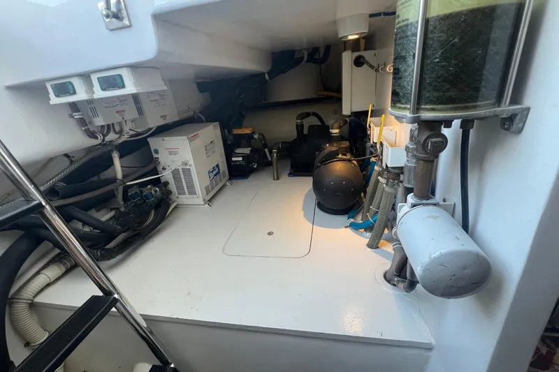 Sixpack Yacht Photos Pics Engine room of 2013 Hatteras GT63 yacht with mechanical equipment and wiring.