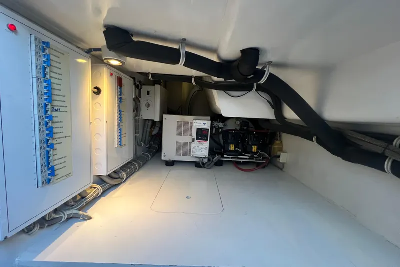 Sixpack Yacht Photos Pics Electrical panel and equipment in 2013 Hatteras GT63 yacht interior.
