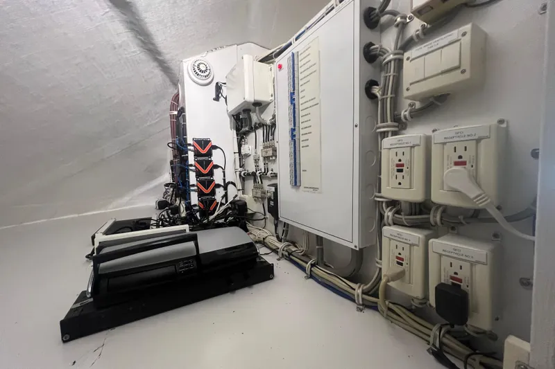 Sixpack Yacht Photos Pics Electrical panel and wiring inside a 2013 Hatteras GT63 yacht.