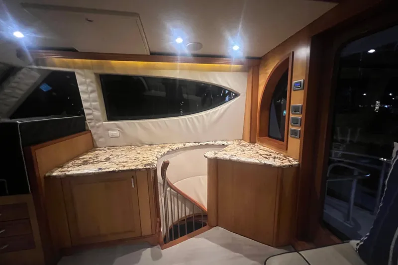 Sixpack Yacht Photos Pics Luxurious interior of 2013 Hatteras GT63 yacht with elegant wood and marble finishes.