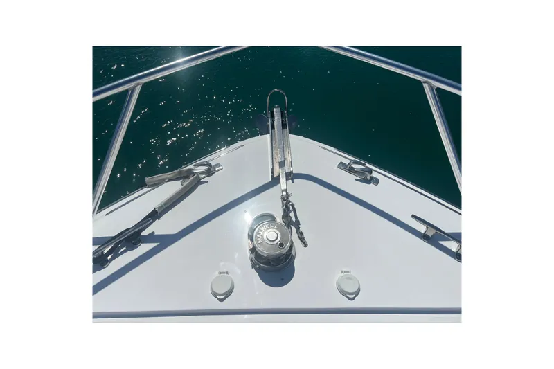 Sixpack Yacht Photos Pics Bow view of 2013 Hatteras GT63 yacht with anchor and winch system.