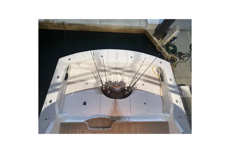 Sixpack Yacht Photos Pics 2013 Hatteras GT63 yacht deck with fishing rods and equipment.