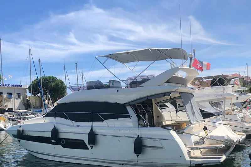 Lola Yacht Photos Pics 2019 Prestige 460 yacht docked at marina under clear blue sky.