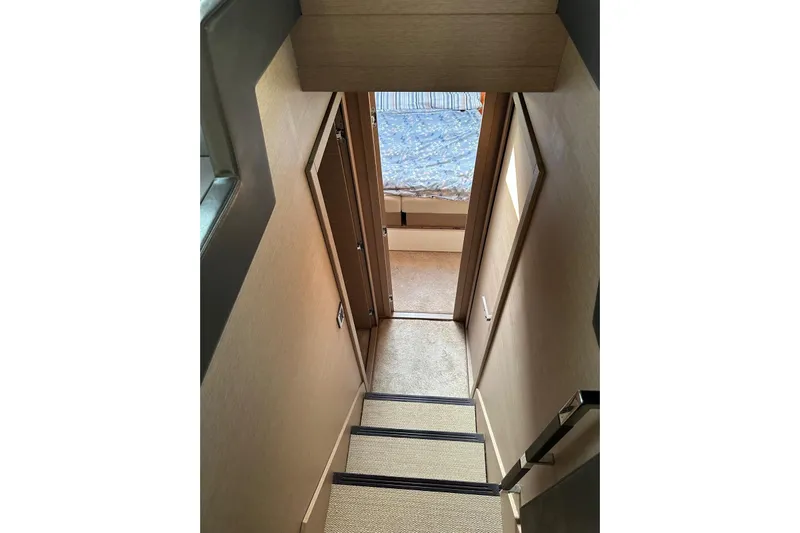 Lola Yacht Photos Pics Stairway leading to cabin interior of 2019 Prestige 460 yacht.