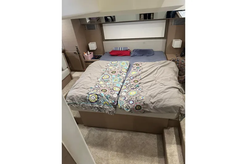 Lola Yacht Photos Pics Luxurious bedroom interior of 2019 Prestige 460 yacht with colorful bedding.