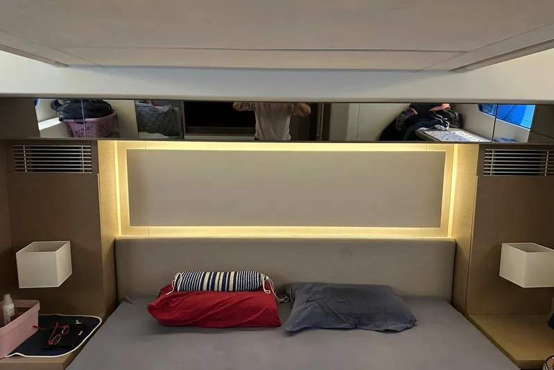 Lola Yacht Photos Pics Luxurious interior of 2019 Prestige 460 yacht with modern lighting and cozy bedding.
