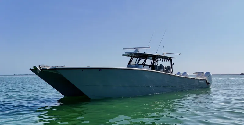  Yacht Photos Pics 2021 Freeman 47 boat on calm water under clear blue sky.