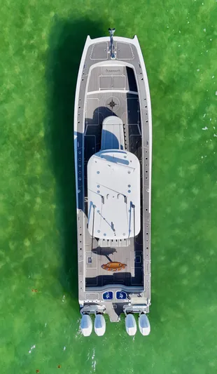  Yacht Photos Pics Aerial view of 2021 Freeman 47 boat on vibrant green water.
