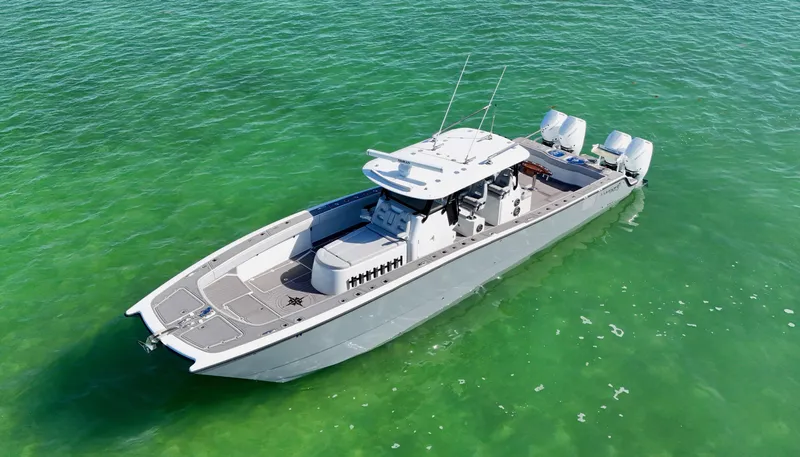  Yacht Photos Pics 2021 Freeman 47 boat on clear green water, aerial view.