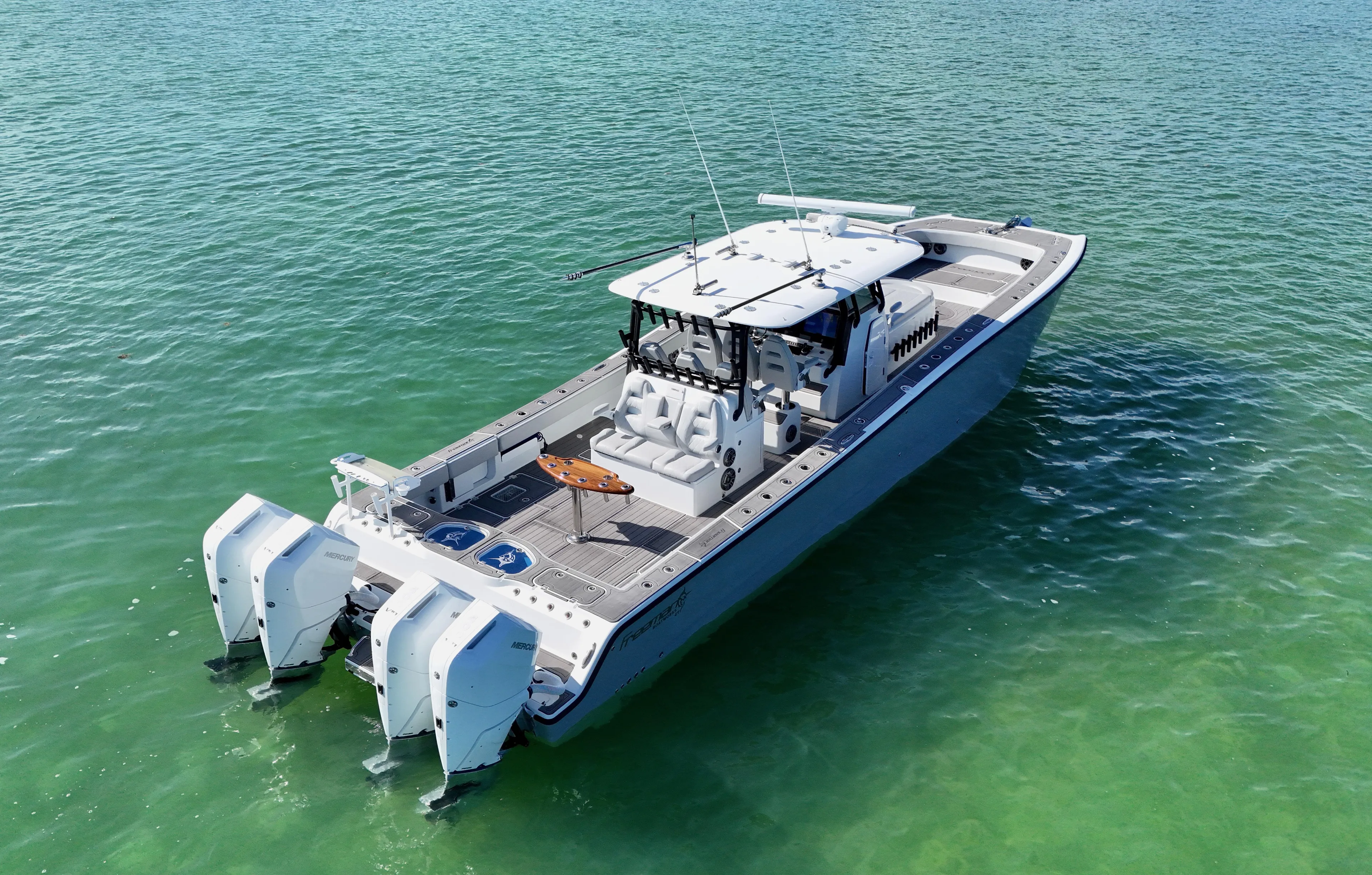  Yacht Photos Pics Aerial view of 2021 Freeman 47 boat on clear turquoise water.