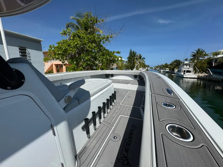  Yacht Photos Pics Freeman 47 boat docked in a scenic canal, showcasing sleek design and modern features.