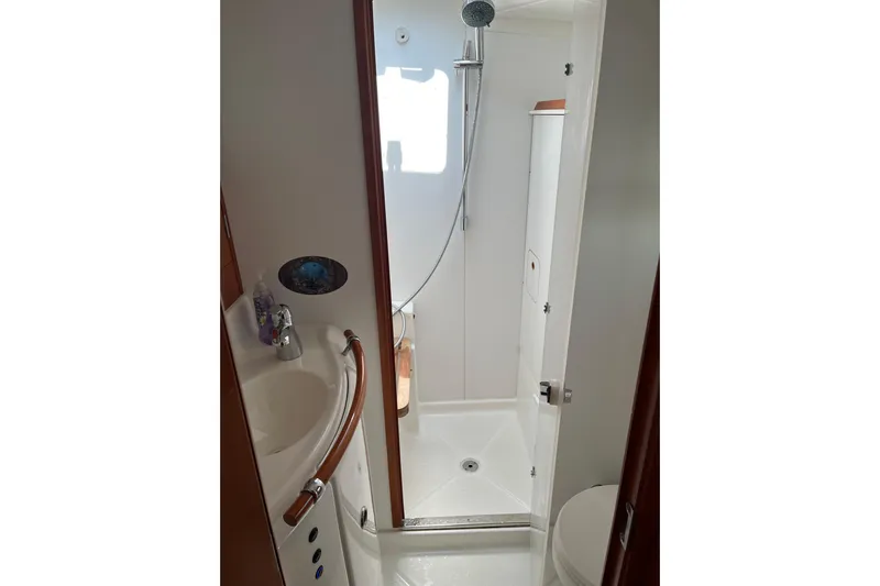 Namaste Yacht Photos Pics Bathroom interior of 2004 Lagoon 380 catamaran with shower and sink.