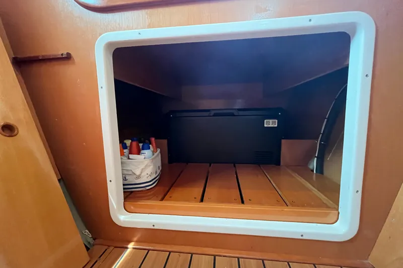 Namaste Yacht Photos Pics Storage compartment on a 2004 Lagoon 380 catamaran with supplies and equipment.