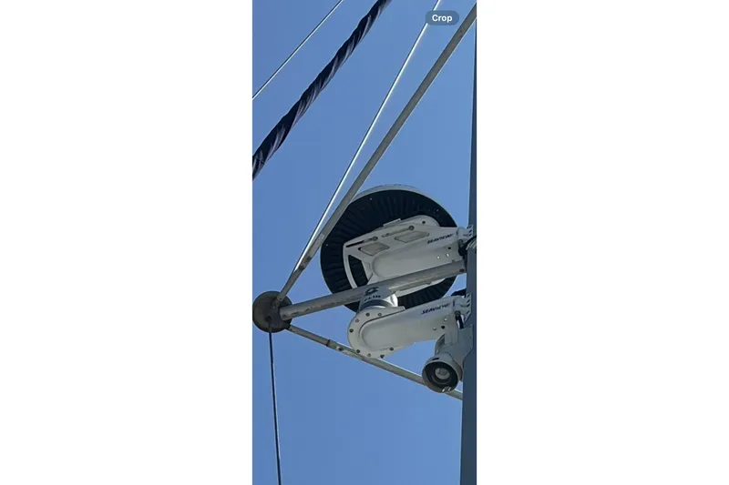 Namaste Yacht Photos Pics Radar equipment on a 2004 Lagoon 380 sailboat against a clear blue sky.