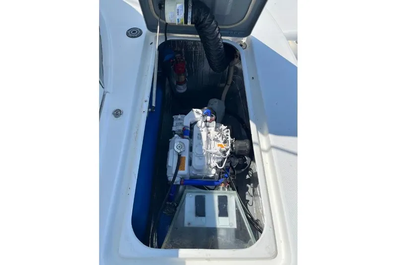 Namaste Yacht Photos Pics Engine compartment of a 2004 Lagoon 380 catamaran, showcasing mechanical components.