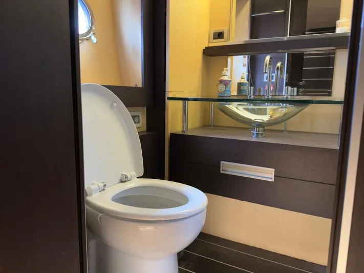  Yacht Photos Pics Luxury bathroom in 2006 Azimut 86S yacht with modern fixtures and glass sink.