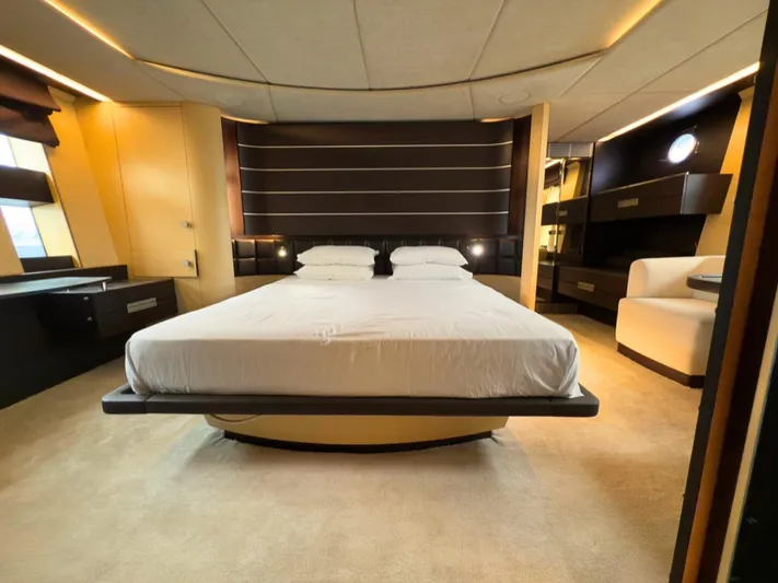  Yacht Photos Pics Luxurious bedroom interior of a 2006 Azimut 86S yacht with modern furnishings.