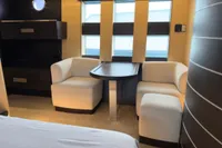 Luxurious interior of 2006 Azimut 86S yacht with elegant seating and table arrangement.
