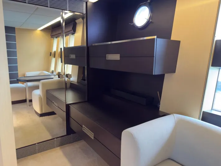  Yacht Photos Pics Luxurious interior of 2006 Azimut 86S yacht with modern furnishings and porthole window.