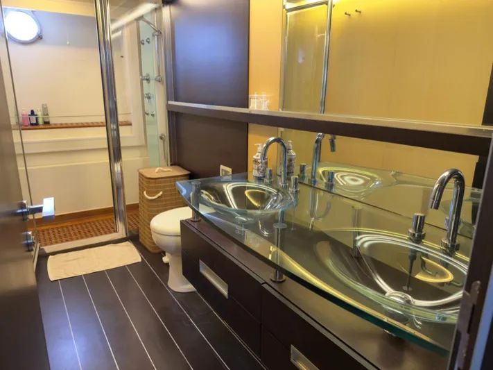 Yacht Photos Pics Luxurious bathroom in 2006 Azimut 86S yacht with modern glass sink and sleek design.