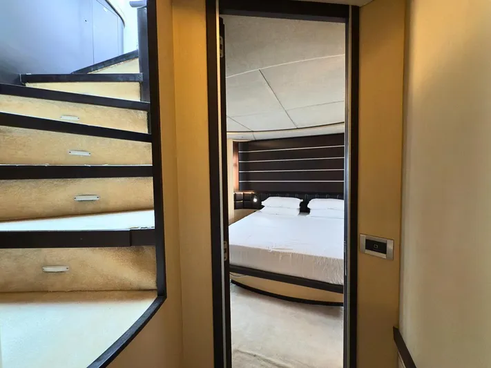  Yacht Photos Pics Interior view of 2006 Azimut 86S yacht showing stairs and bedroom.