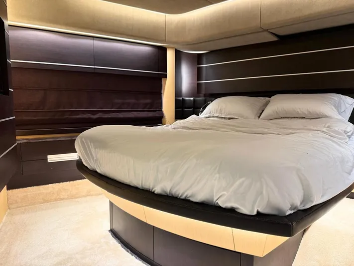  Yacht Photos Pics Luxurious bedroom interior of 2006 Azimut 86S yacht with modern design and cozy bedding.