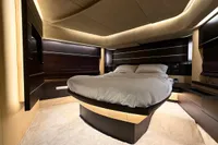 Luxurious bedroom interior of 2006 Azimut 86S yacht with modern design and ambient lighting.