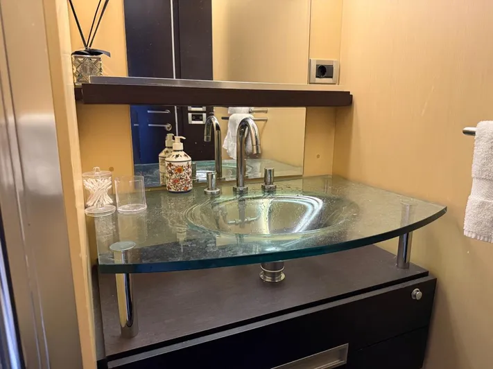  Yacht Photos Pics Luxurious bathroom sink with glass countertop in 2006 Azimut 86S yacht.