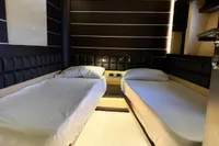 Interior of 2006 Azimut 86S yacht with twin beds and modern design.