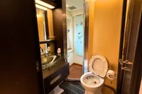 Luxurious bathroom in a 2006 Azimut 86S yacht, featuring modern fixtures and elegant design.