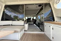 Luxurious interior of 2006 Azimut 86S yacht with spacious seating and modern design.