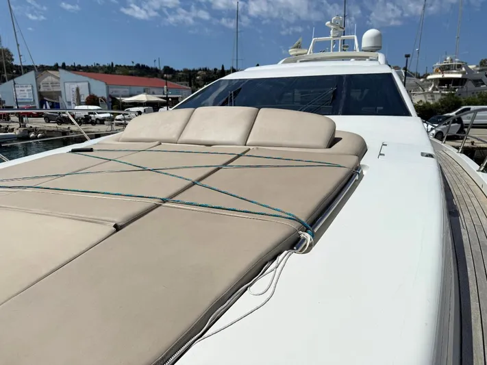  Yacht Photos Pics 2006 Azimut 86S yacht with sunbathing deck, docked at marina under clear sky.