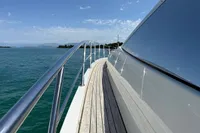 2006 Azimut 86S yacht deck with sleek railing, cruising on calm blue waters.
